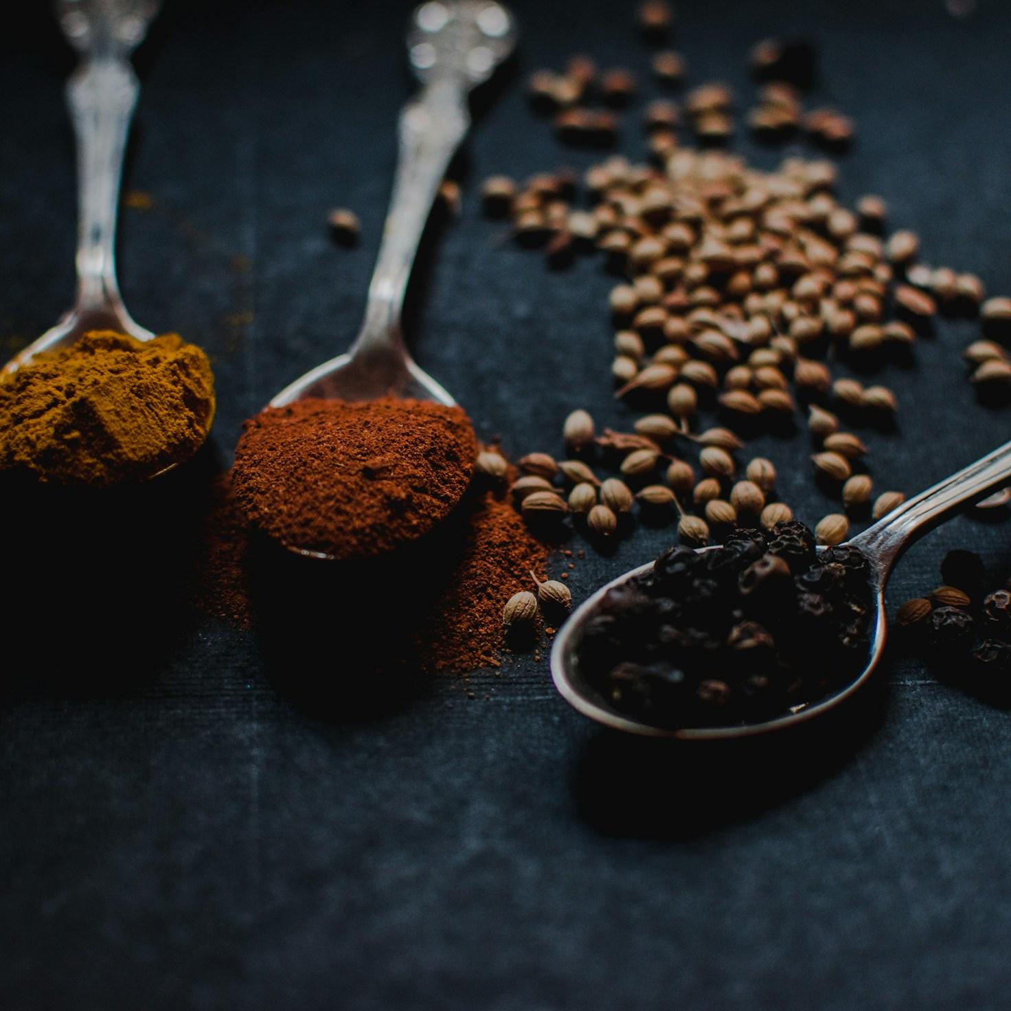 Community members collaborating in a modern kitchen space, sharing recipes and cooking techniques